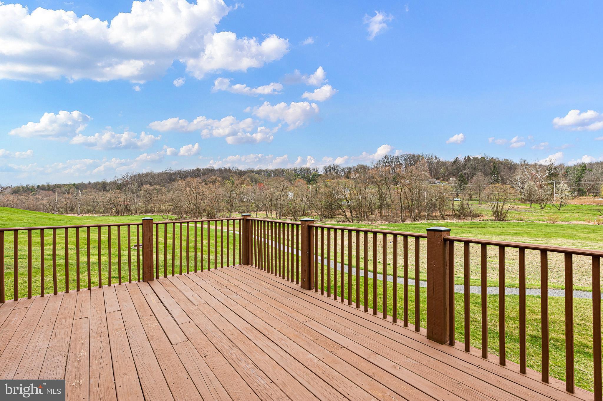 719 Jacques Circle Chester Springs, PA 19425 - Photo 7 of 31 a view of balcony with wooden floor and fence