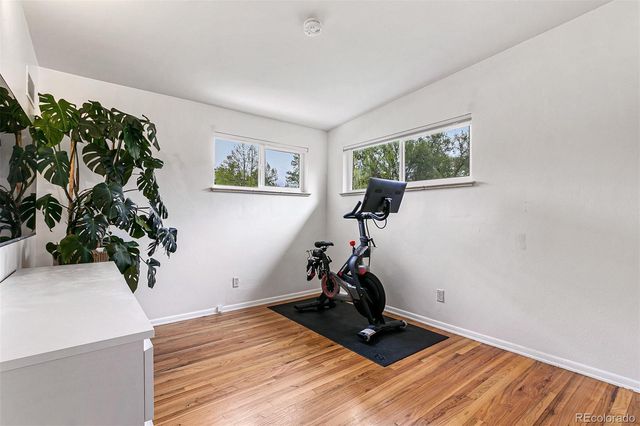a view of a room with gym equipment and a window