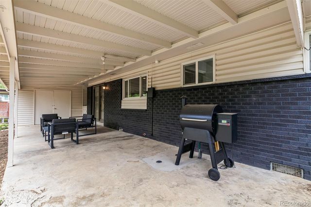a view of a workspace with furniture