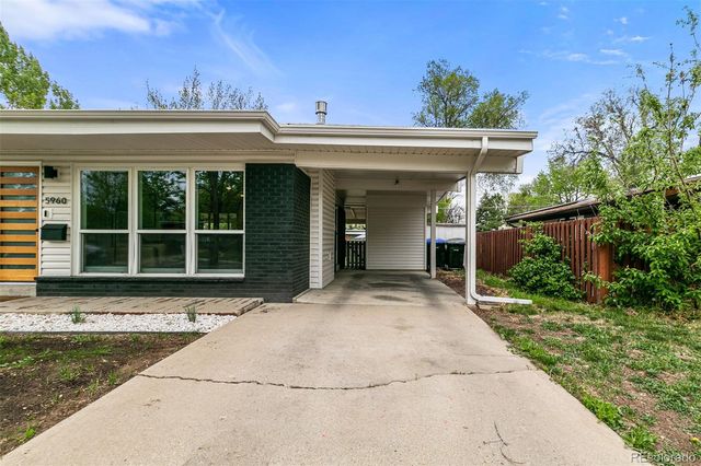 a view of white house with a outdoor space