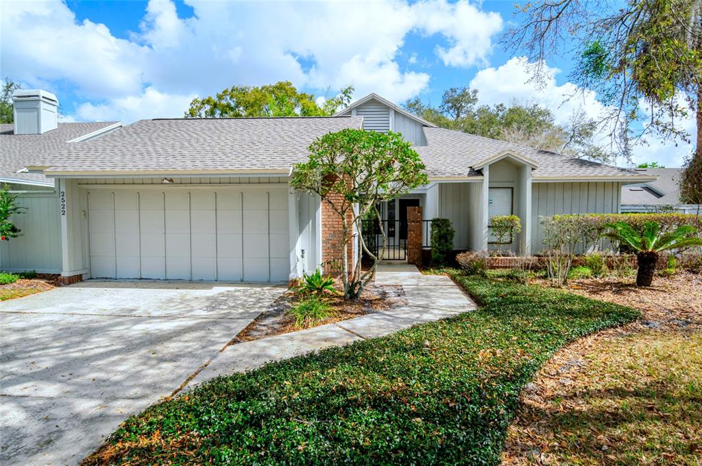 2522 Thicket Ridge Court Longwood, FL 32779 - Photo 1 of 1 a front view of a house with garden