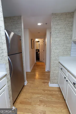 a view of a kitchen from the hallway