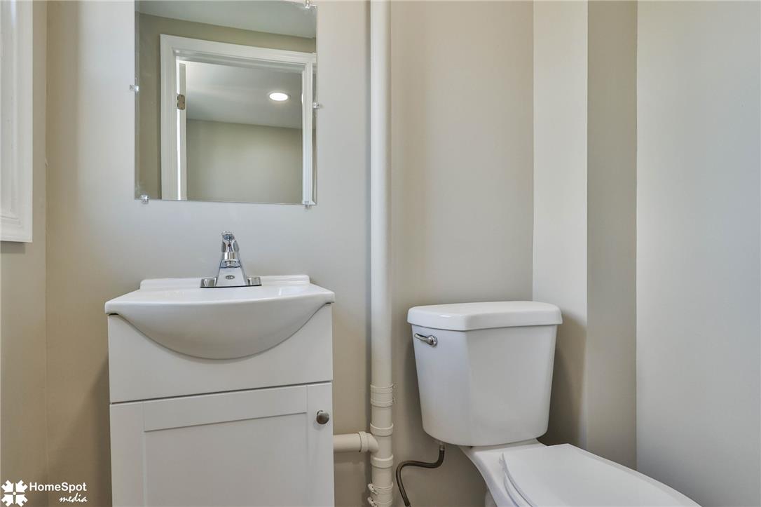 619 Sioux Street Bethlehem, PA 18015 - Photo 24 of 61 a bathroom with a toilet sink and mirror