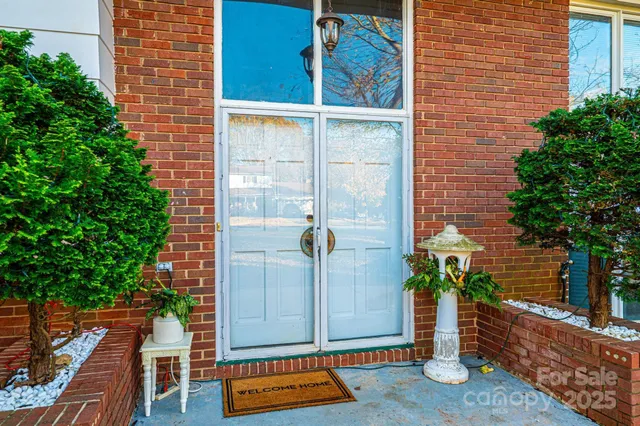 front view of a house with a potted plant