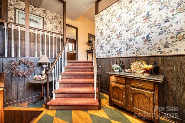 a view of entryway with wooden floor