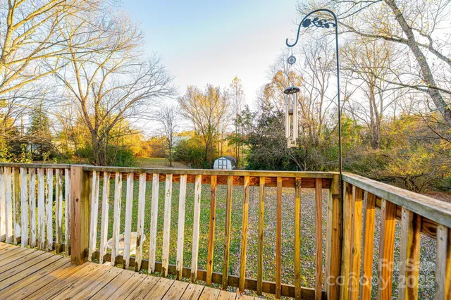 a view of a porch with wooden floor and outdoor space