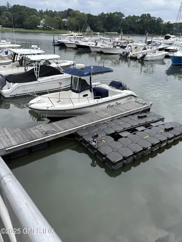 a view of swimming pool with outdoor seating and lake view