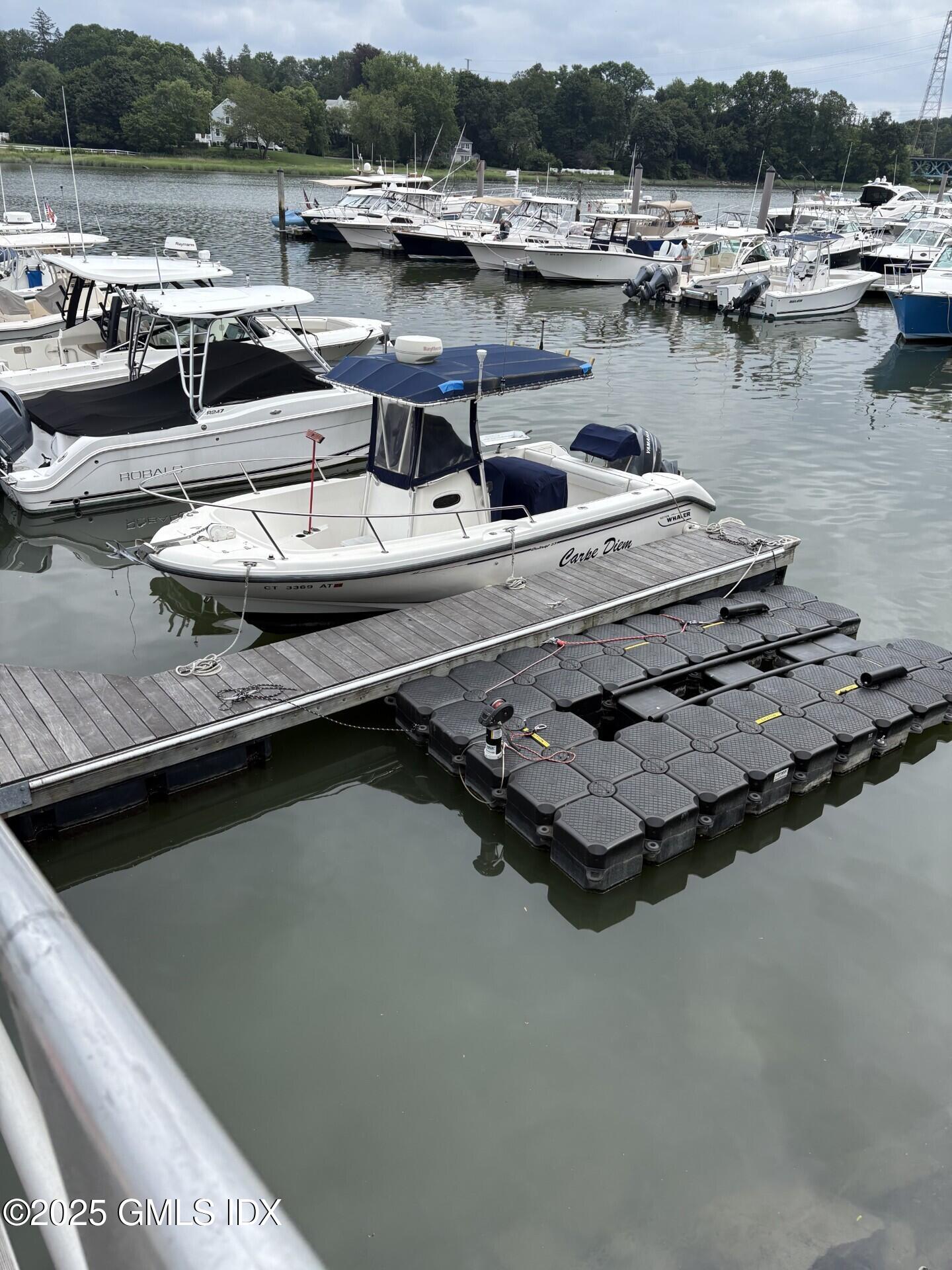 7 River Road, Unit BOAT SLIP A2 Cos Cob, CT 06807 - Photo 2 of 7 a view of swimming pool with outdoor seating and lake view