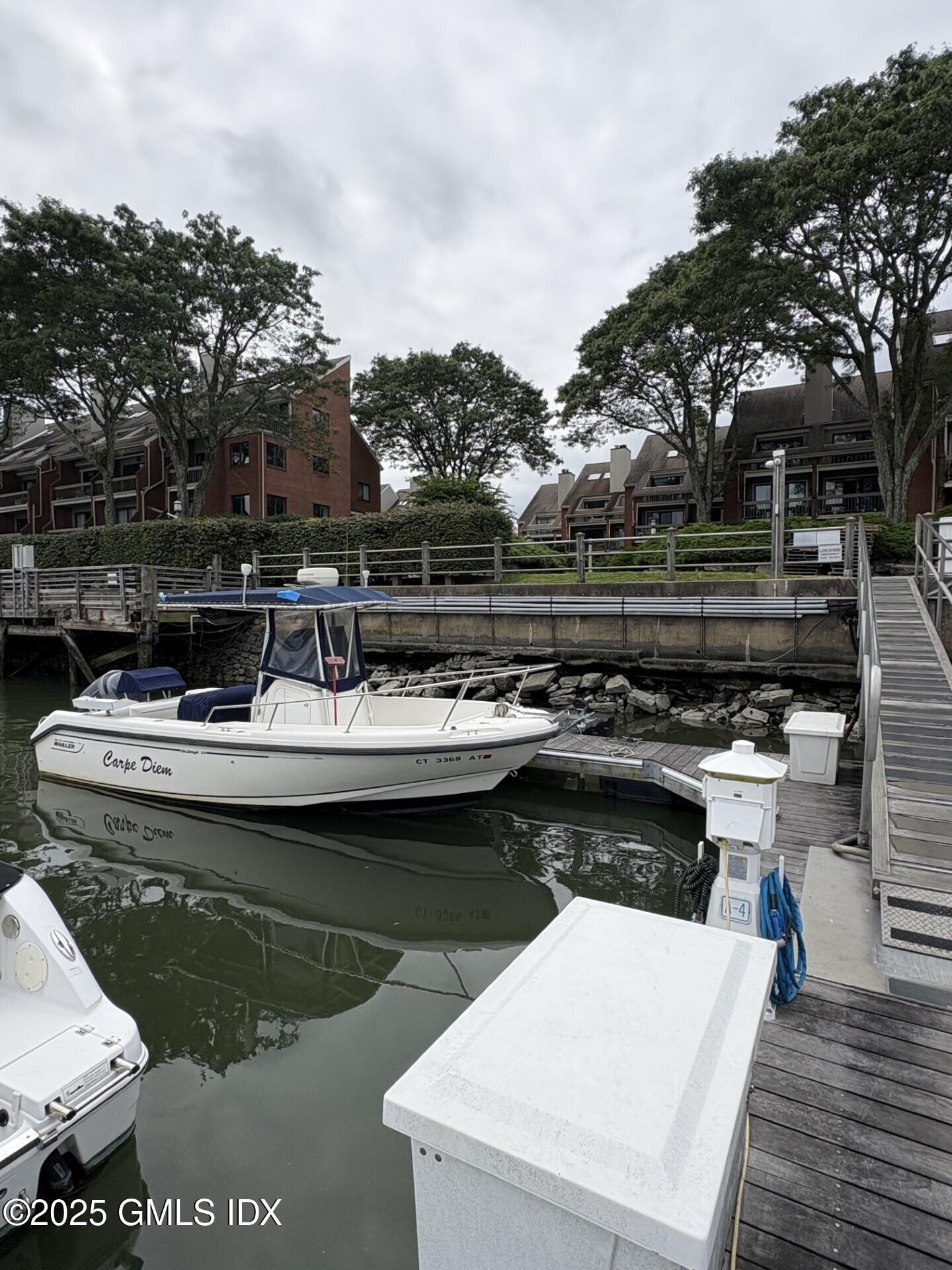 7 River Road, Unit BOAT SLIP A2 Cos Cob, CT 06807 - Photo 5 of 7 a view of a swimming pool with a patio