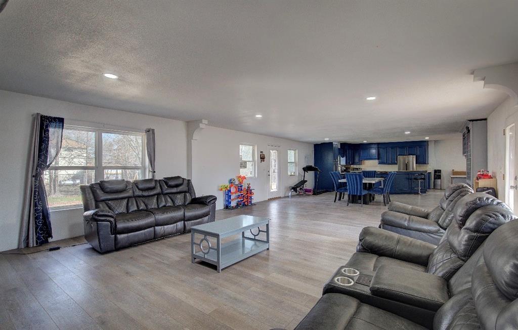 11291 Goss Street Wills Point, TX 75169 - Photo 12 of 23 a living room with furniture and a large window