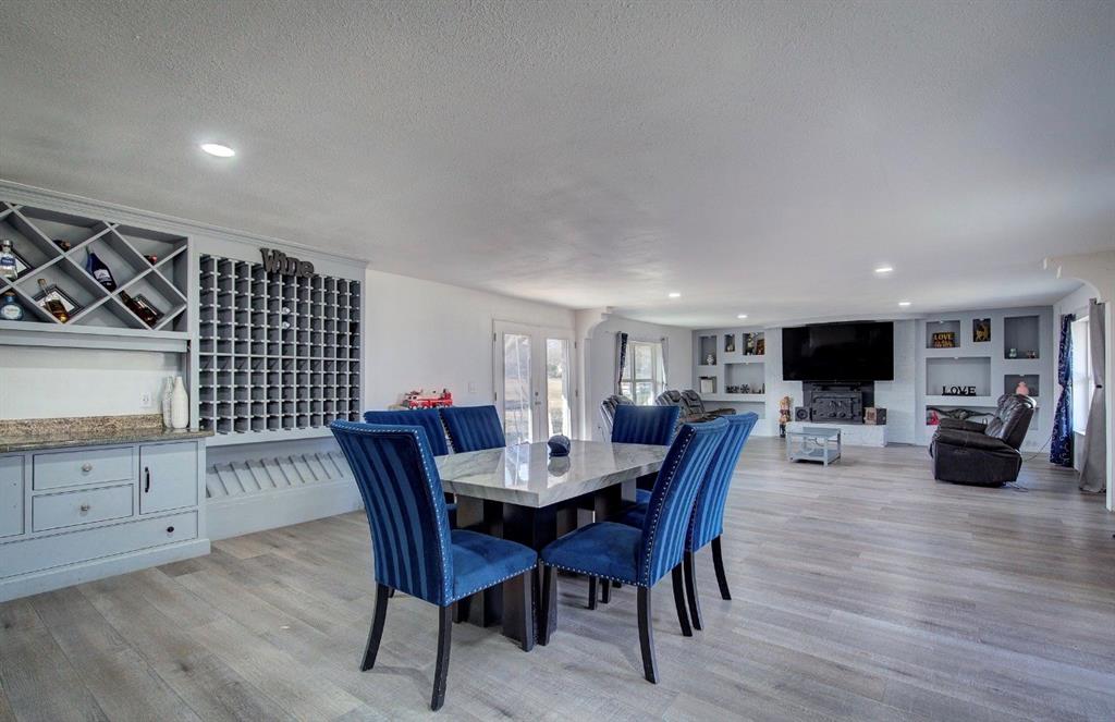 11291 Goss Street Wills Point, TX 75169 - Photo 13 of 23 a view of a dining room with furniture and wooden floor