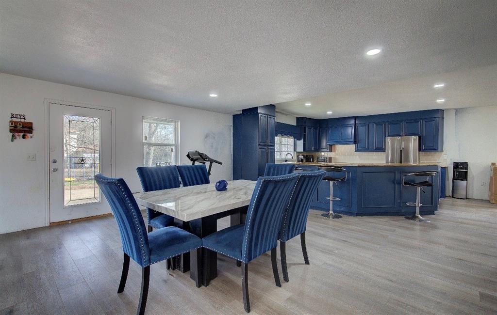 11291 Goss Street Wills Point, TX 75169 - Photo 15 of 23 a view of a dining room with furniture window and wooden floor