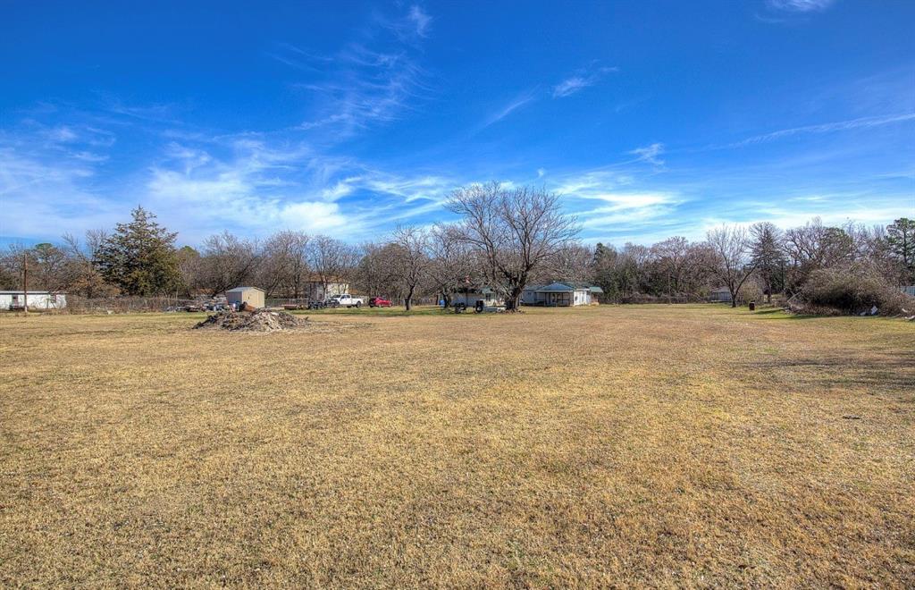 11291 Goss Street Wills Point, TX 75169 - Photo 22 of 23 a view of dirt field with trees