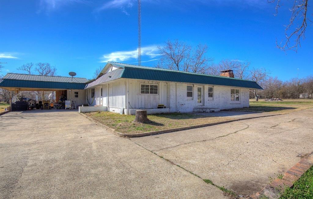 11291 Goss Street Wills Point, TX 75169 - Photo 3 of 23 a view of a house with wooden fence