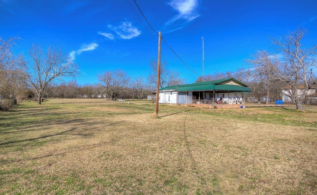 11291 Goss Street Wills Point, TX 75169 - Photo 5 of 23 a view of a swimming pool with a table and chairs under an umbrella