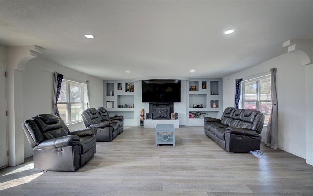11291 Goss Street Wills Point, TX 75169 - Photo 7 of 23 a living room with furniture flat screen tv and couches