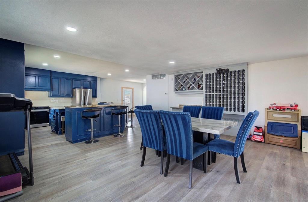 11291 Goss Street Wills Point, TX 75169 - Photo 10 of 23 a view of a dining room with furniture a rug and wooden floor