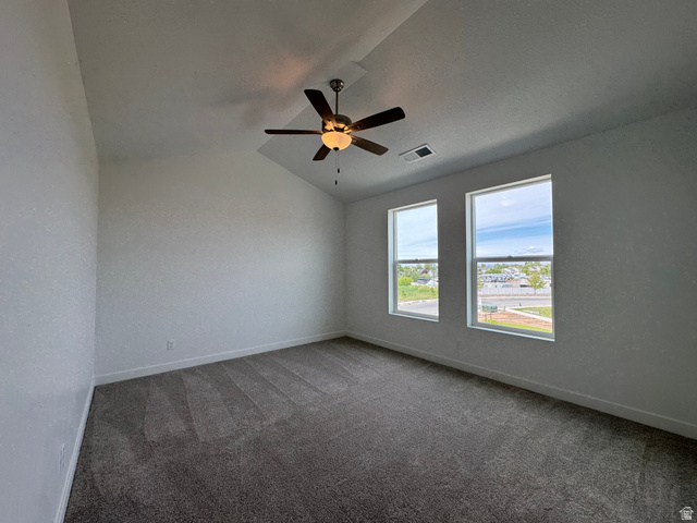 1876 West 1575th North, Unit 237 Layton, UT 84041 - Photo 15 of 20 Carpeted spare room with vaulted ceiling and a ceiling fan