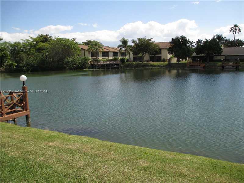 745 Banks Road, Unit 745 Margate, FL 33063 - Photo 9 of 13 a view of a lake with houses