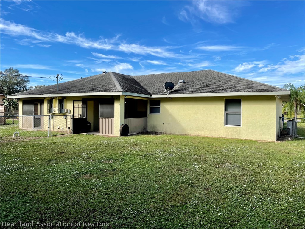 1812 Wightman Avenue Sebring, FL 33870 - Photo 22 of 22 a front view of a house with a garden