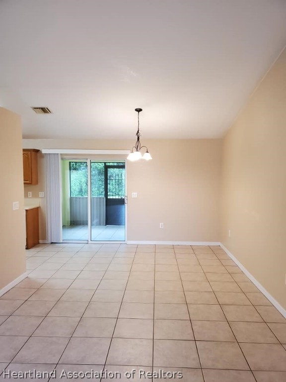 1812 Wightman Avenue Sebring, FL 33870 - Photo 9 of 22 a view of an empty room with a window