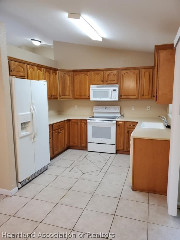 1812 Wightman Avenue Sebring, FL 33870 - Photo 10 of 22 a kitchen with stainless steel appliances granite countertop a sink counter space and cabinets