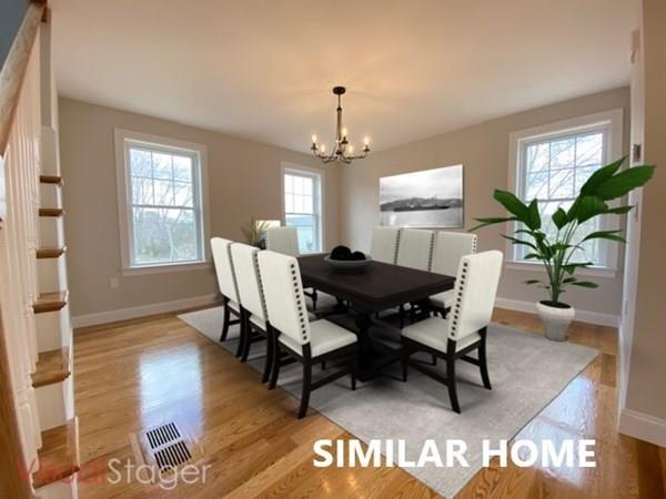2 Braemore Road Billerica, MA 01821 - Photo 4 of 6 a dining room with furniture potted plants and wooden floor