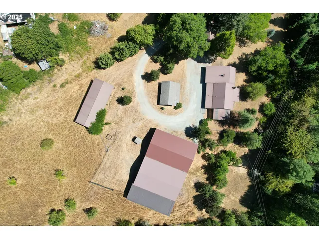 a aerial view of a house with a yard