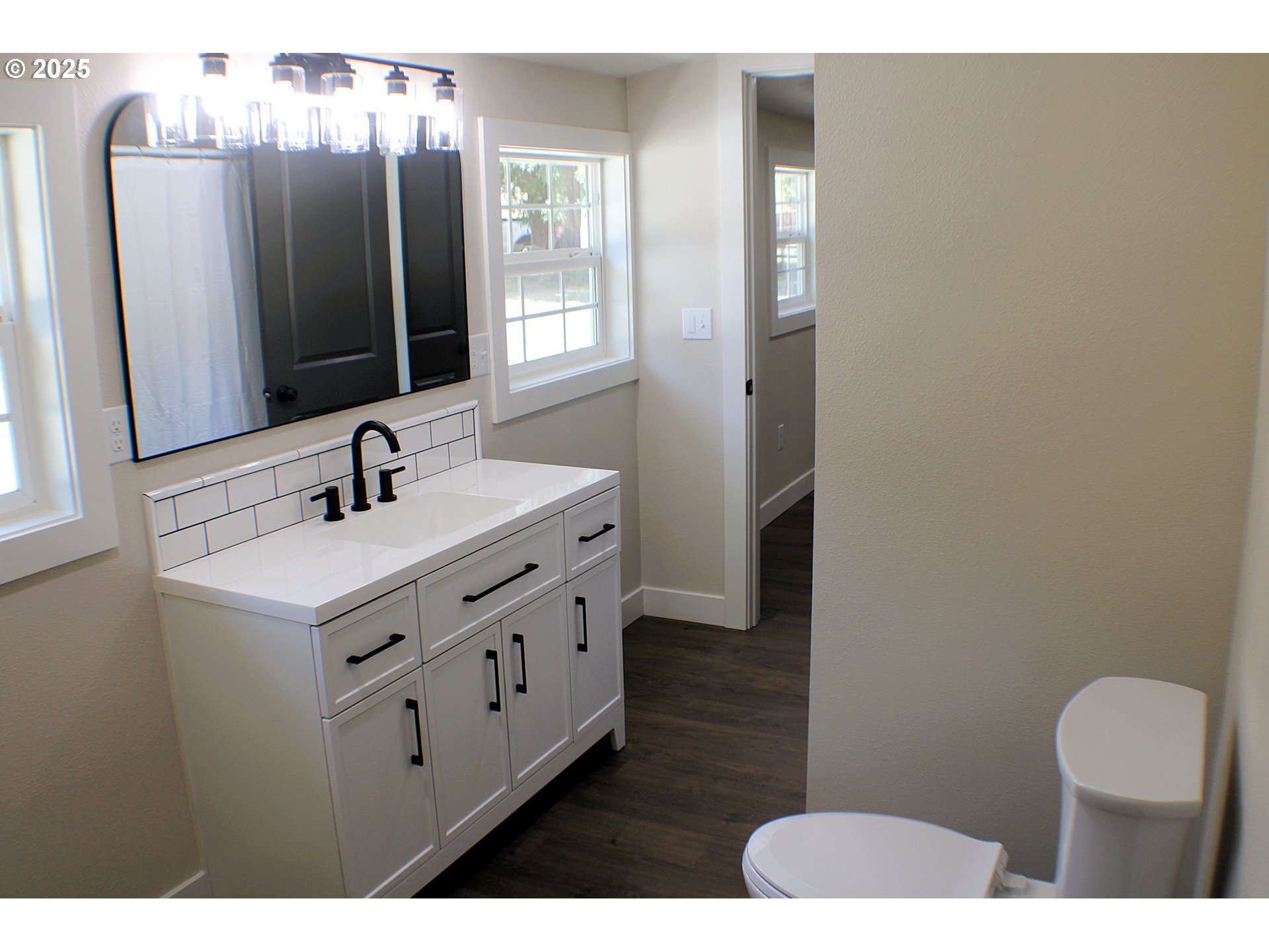 3450 Shoestring Road Riddle, OR 97469 - Photo 14 of 48 a bathroom with a sink vanity and mirror