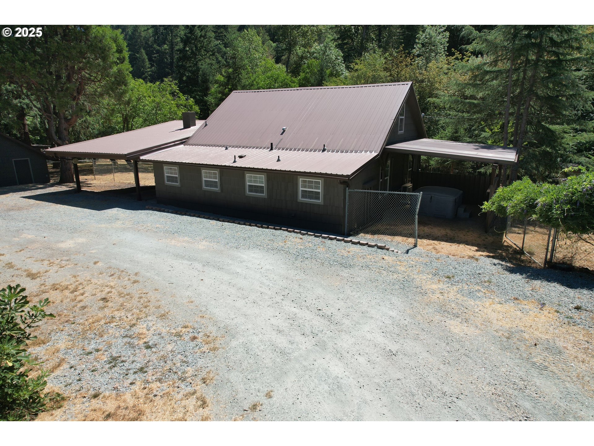 3450 Shoestring Road Riddle, OR 97469 - Photo 2 of 48 a aerial view of a house with a yard