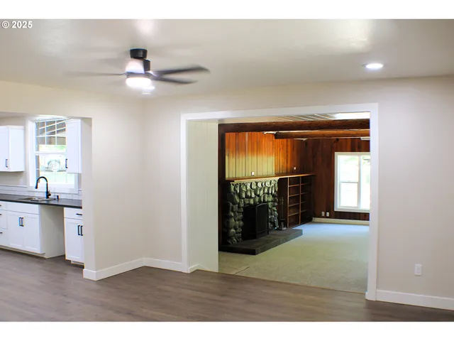 a kitchen with stainless steel appliances a refrigerator and a stove top oven