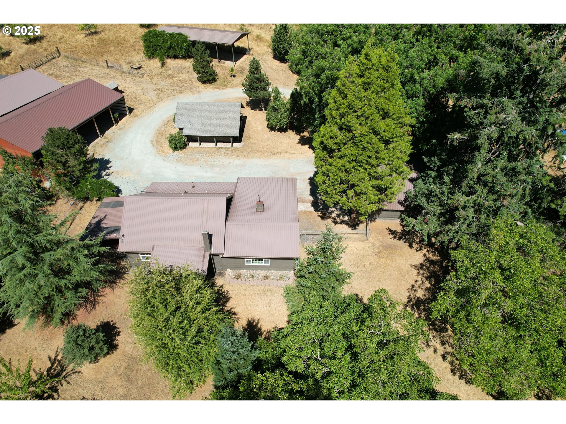 3450 Shoestring Road Riddle, OR 97469 - Photo 43 of 48 an aerial view of a house with a yard