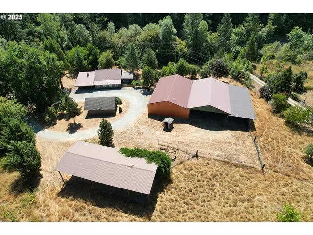 a aerial view of a house with a yard