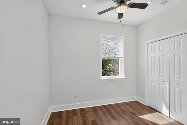 a view of room with window and ceiling fan