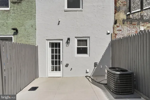 a view of a room with wooden fence