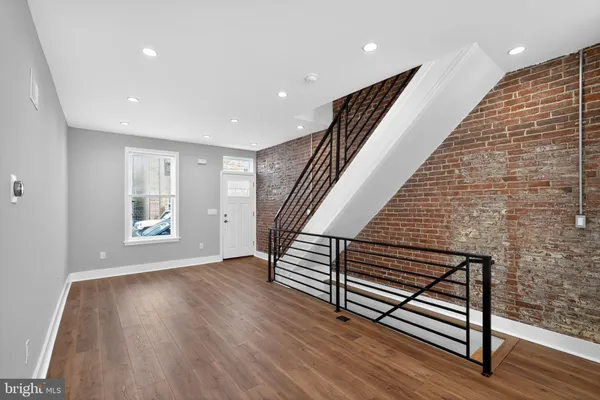 a view of entryway with wooden floor