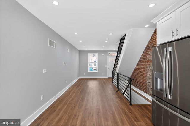 a view of entryway with wooden floor