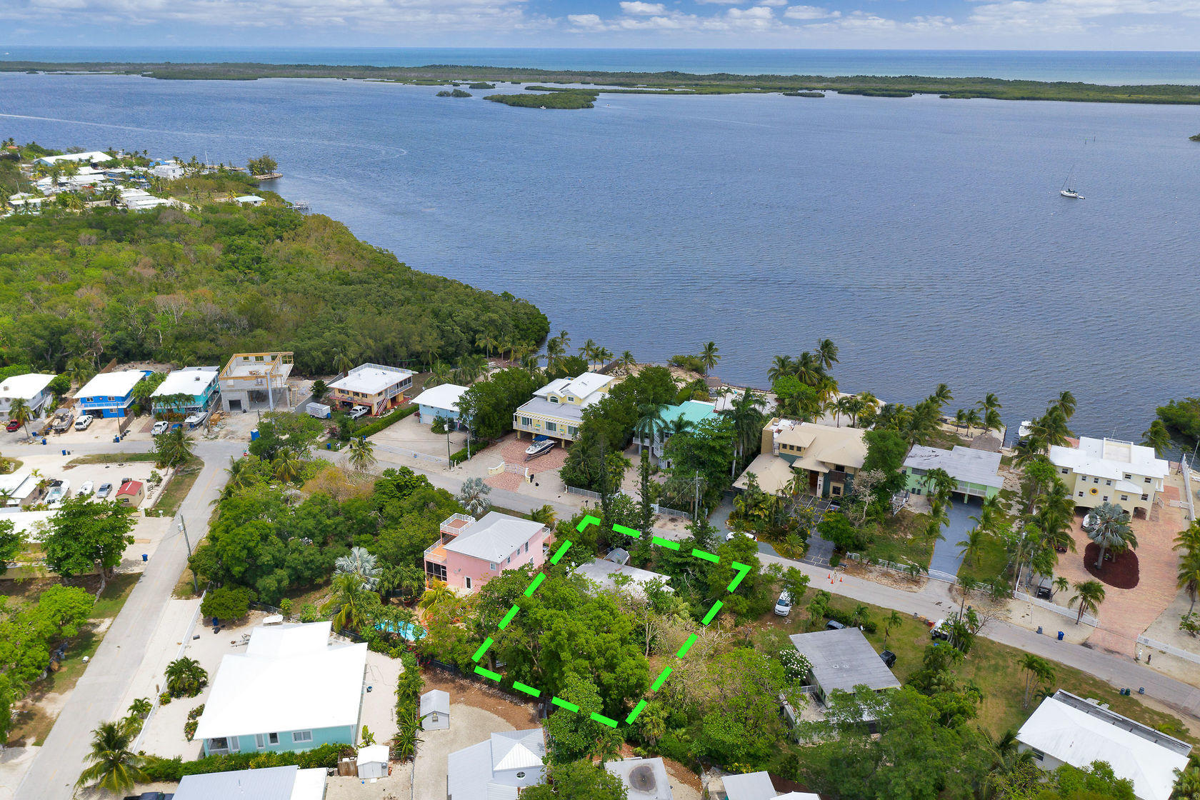 353 Sound Drive Key Largo, FL 33037 - Photo 12 of 28 an aerial view of a house with a yard and lake view
