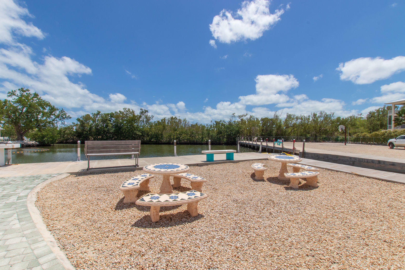 353 Sound Drive Key Largo, FL 33037 - Photo 15 of 28 a view of a swimming pool with a table and chairs