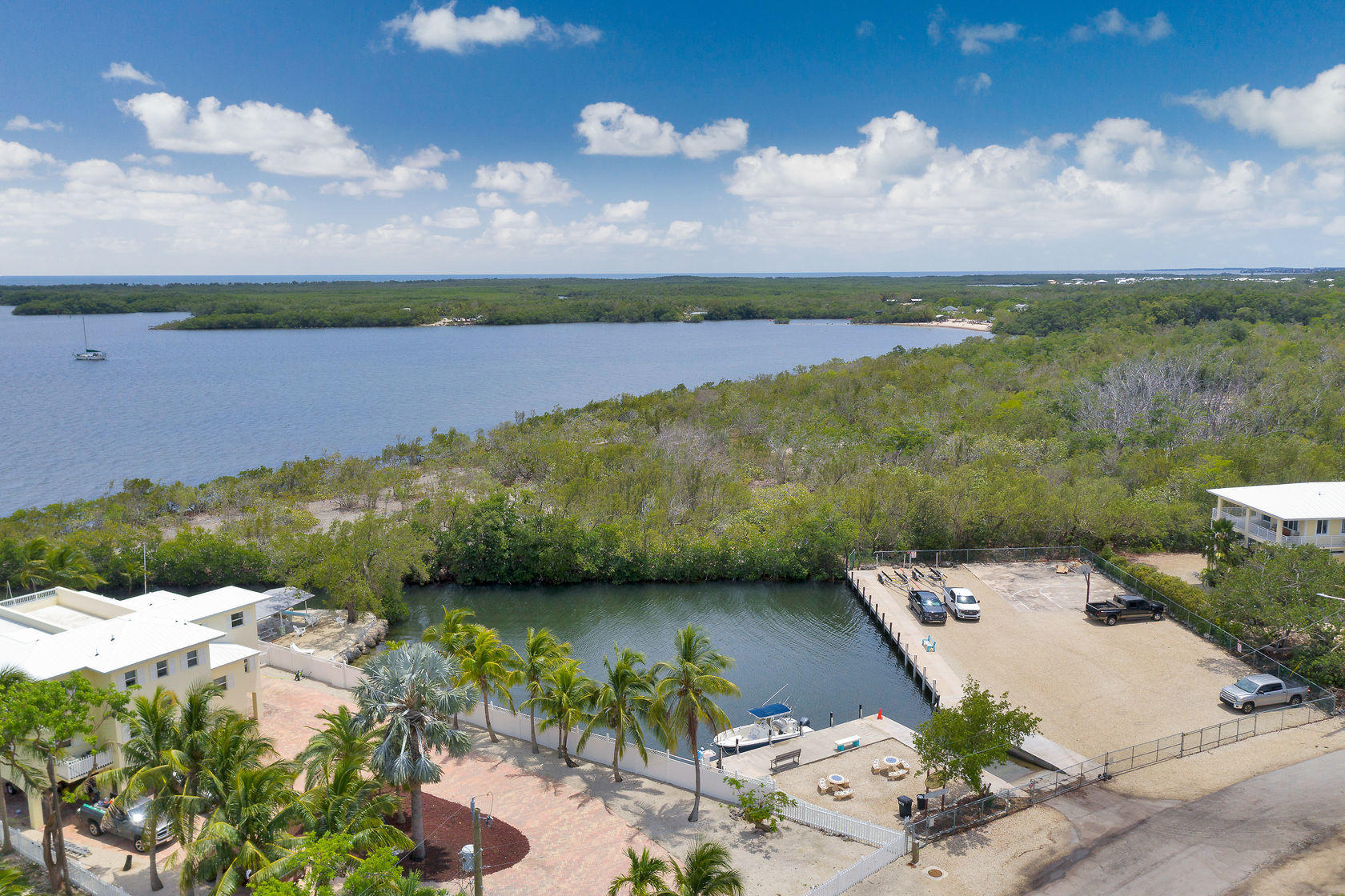 353 Sound Drive Key Largo, FL 33037 - Photo 17 of 28 an aerial view of a house with garden space and lake view in back