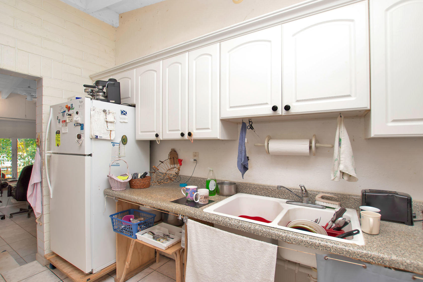 353 Sound Drive Key Largo, FL 33037 - Photo 20 of 28 a room with a refrigerator and a window