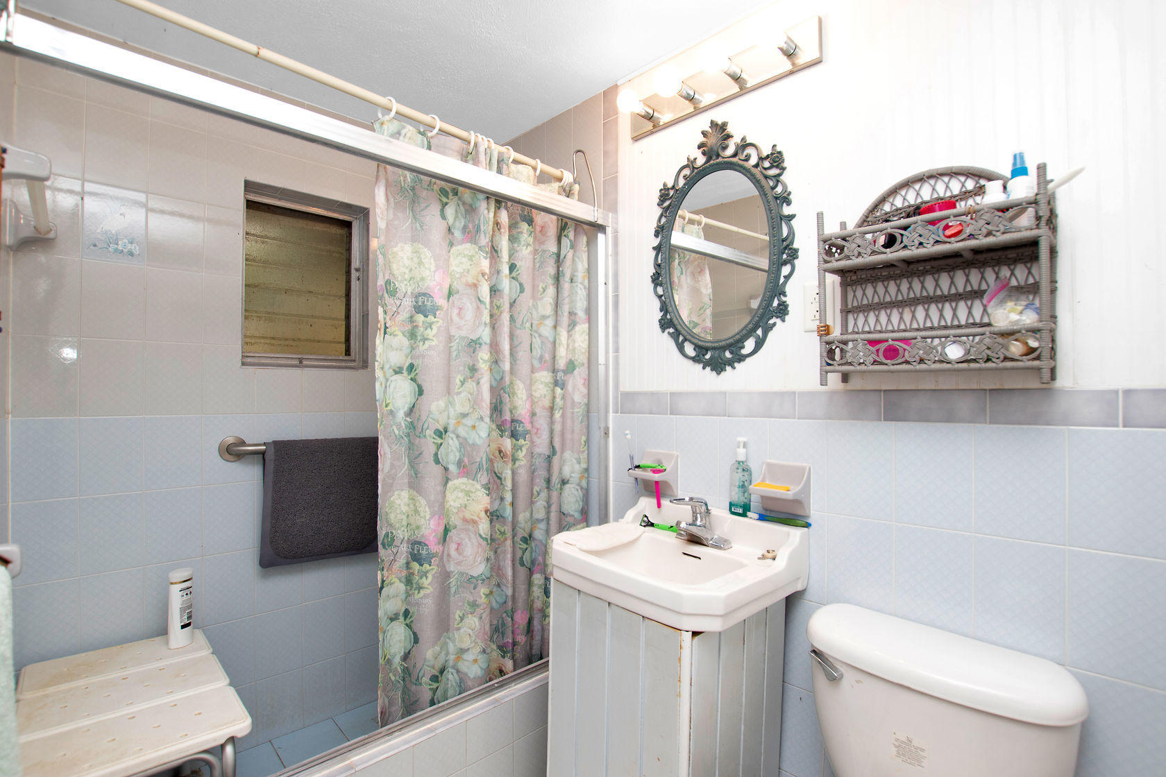 353 Sound Drive Key Largo, FL 33037 - Photo 7 of 28 a bathroom with a sink and a toilet