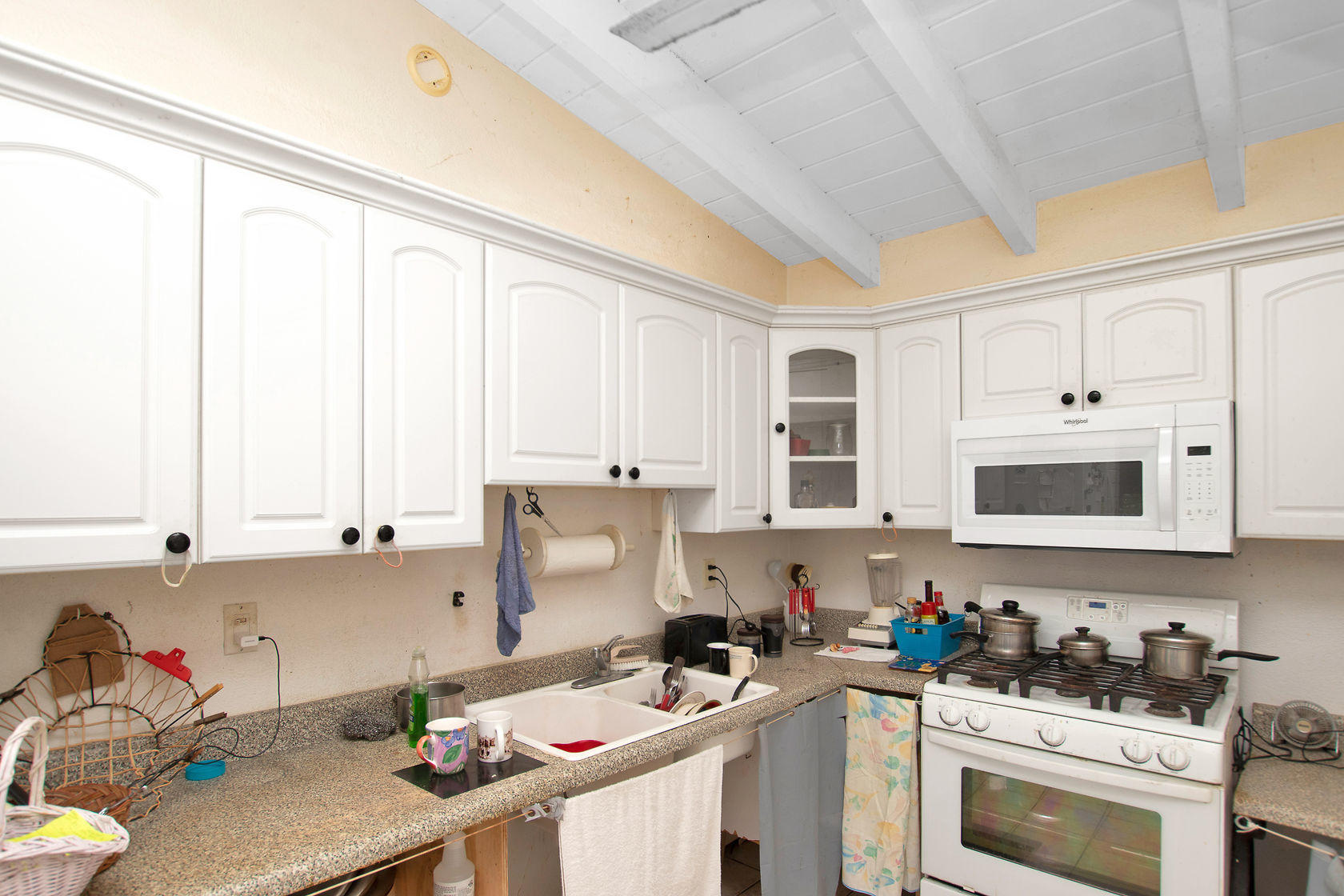 353 Sound Drive Key Largo, FL 33037 - Photo 9 of 28 a kitchen with a sink stove top oven and cabinets