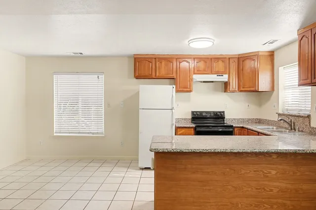 a view of storage and utility room with washer and dryer