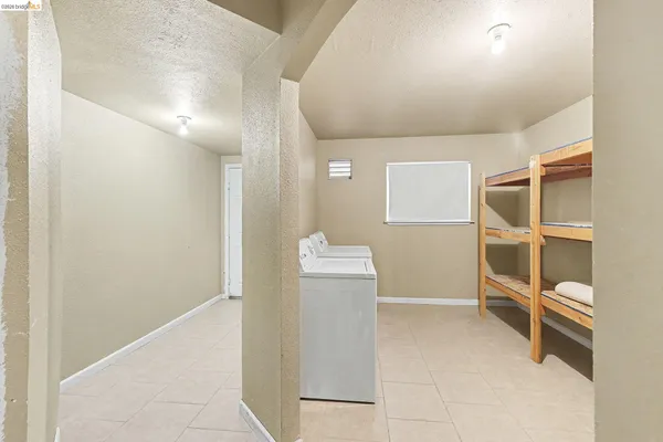 a view of a hallway to rooms and stairs