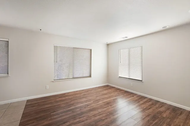 a kitchen with a white cabinets and white appliances