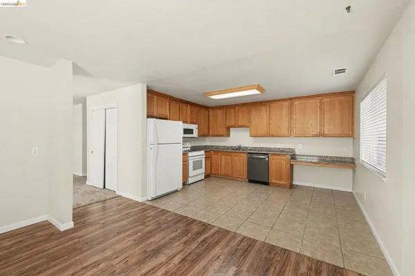 a kitchen with stainless steel appliances a refrigerator and a sink