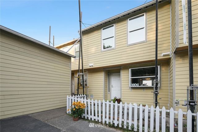 a front view of a house with a garage
