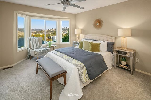 a bed room with a bed and a chandelier