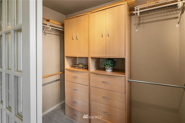 a bathroom with a shower and a sink